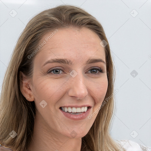 Joyful white young-adult female with long  brown hair and grey eyes