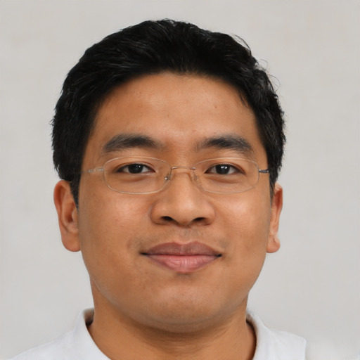 Joyful asian young-adult male with short  black hair and brown eyes