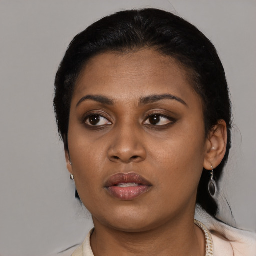 Neutral black young-adult female with medium  black hair and brown eyes