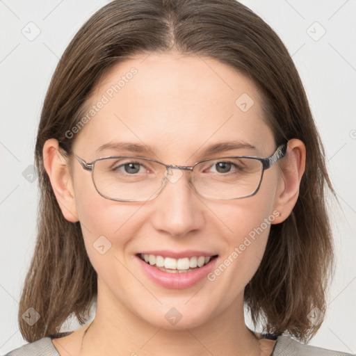 Joyful white adult female with medium  brown hair and grey eyes