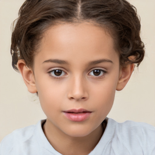 Joyful white child female with short  brown hair and brown eyes