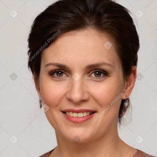 Joyful white young-adult female with medium  brown hair and green eyes