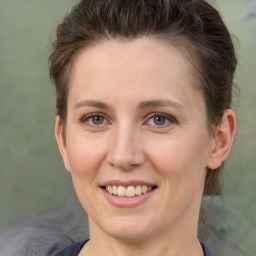 Joyful white adult female with short  brown hair and brown eyes