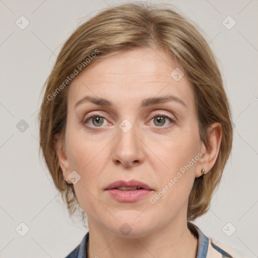 Joyful white adult female with medium  brown hair and grey eyes