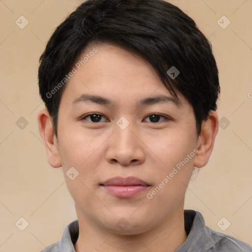 Joyful asian young-adult male with short  black hair and brown eyes