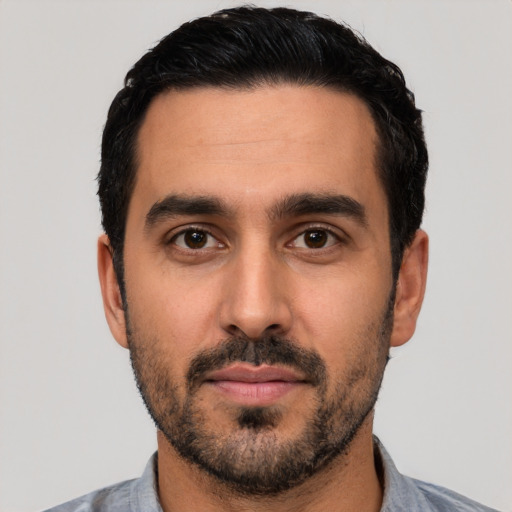Neutral latino young-adult male with short  black hair and brown eyes