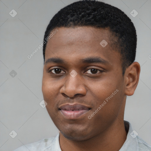 Joyful black young-adult male with short  black hair and brown eyes