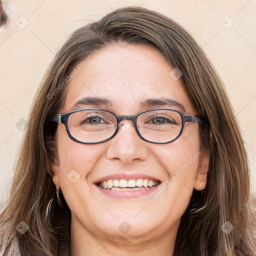 Joyful white adult female with long  brown hair and grey eyes