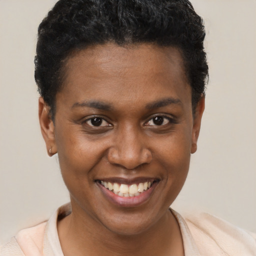 Joyful black young-adult female with short  brown hair and brown eyes