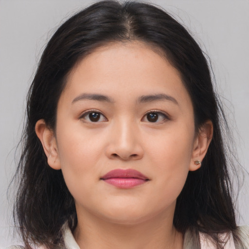 Joyful asian young-adult female with long  brown hair and brown eyes