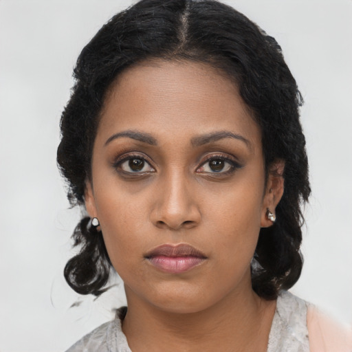Neutral black young-adult female with long  brown hair and brown eyes