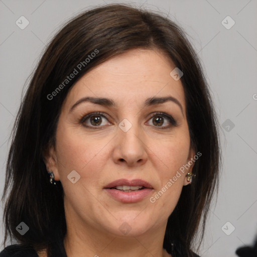 Joyful white adult female with medium  brown hair and brown eyes