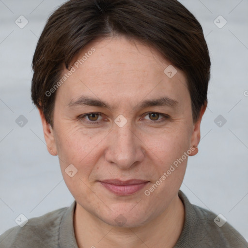 Joyful white adult female with short  brown hair and grey eyes