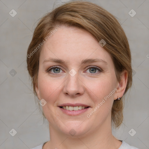 Joyful white young-adult female with medium  brown hair and blue eyes