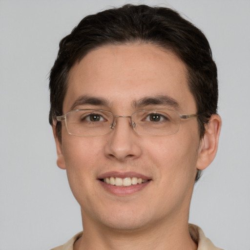 Joyful white young-adult male with short  brown hair and brown eyes