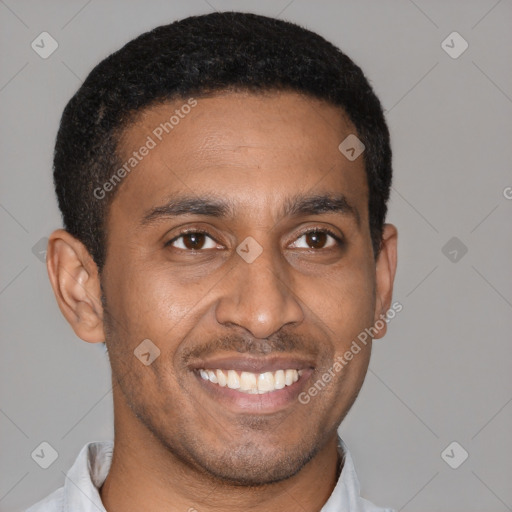 Joyful latino young-adult male with short  brown hair and brown eyes