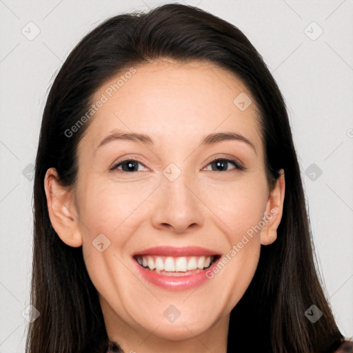 Joyful white adult female with long  brown hair and brown eyes