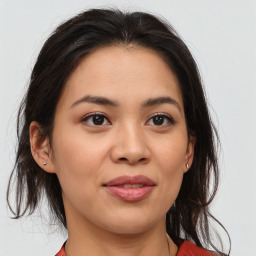 Joyful asian young-adult female with medium  brown hair and brown eyes