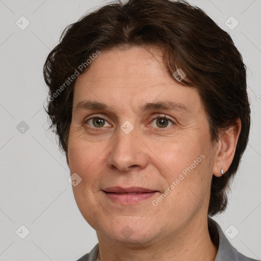 Joyful white adult female with short  brown hair and grey eyes