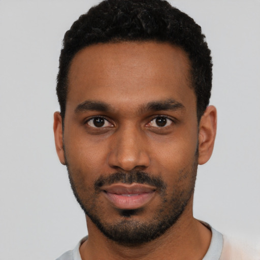 Neutral black young-adult male with short  black hair and brown eyes