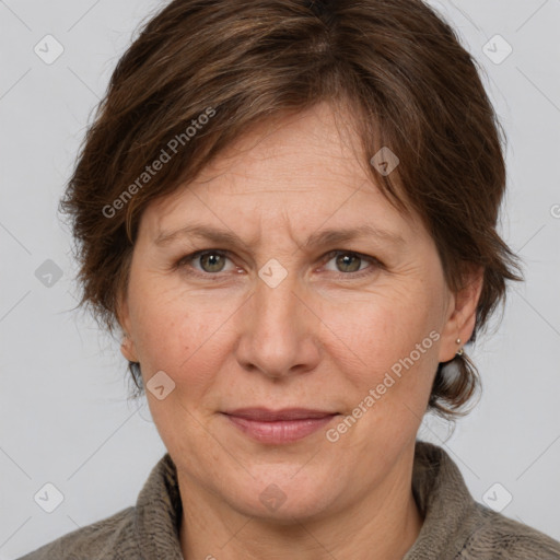 Joyful white adult female with medium  brown hair and grey eyes