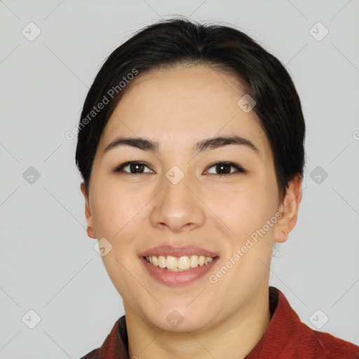 Joyful asian young-adult female with short  black hair and brown eyes