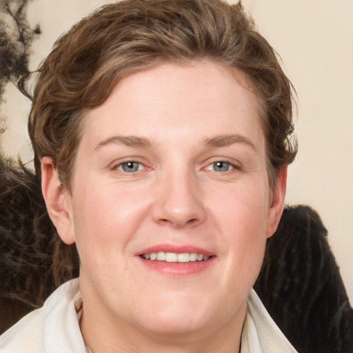 Joyful white young-adult female with medium  brown hair and blue eyes