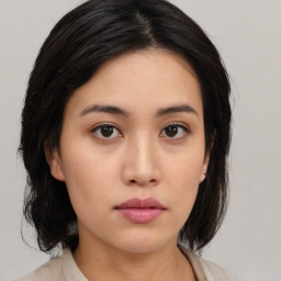 Neutral asian young-adult female with medium  black hair and brown eyes