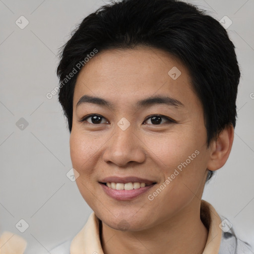 Joyful asian young-adult female with short  brown hair and brown eyes