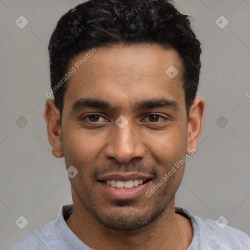 Joyful latino young-adult male with short  black hair and brown eyes