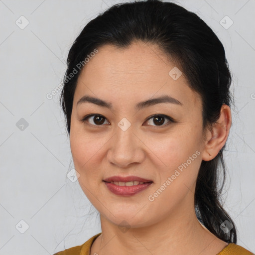 Joyful latino young-adult female with medium  brown hair and brown eyes