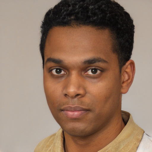 Neutral black young-adult male with short  black hair and brown eyes