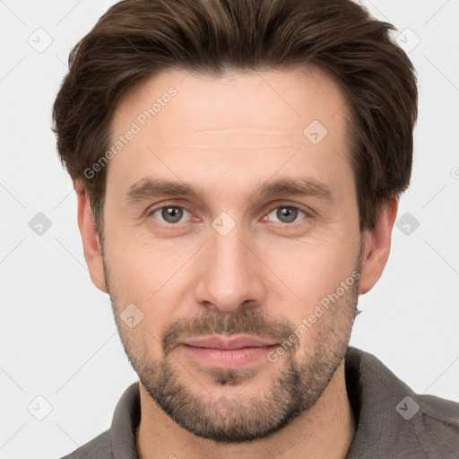 Joyful white adult male with short  brown hair and grey eyes