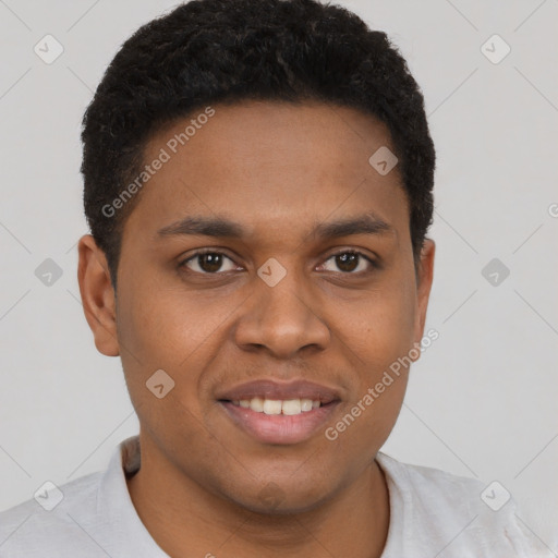 Joyful black young-adult male with short  brown hair and brown eyes