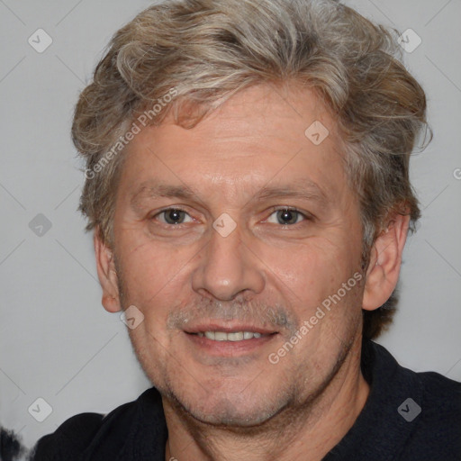 Joyful white middle-aged male with short  brown hair and brown eyes