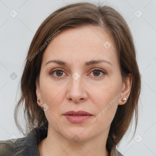 Joyful white adult female with medium  brown hair and grey eyes