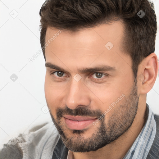 Joyful white young-adult male with short  brown hair and brown eyes