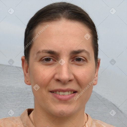 Joyful white adult female with short  brown hair and brown eyes