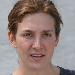 Joyful white adult female with short  brown hair and brown eyes