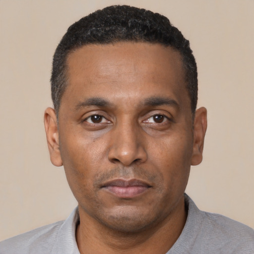 Neutral black young-adult male with short  black hair and brown eyes