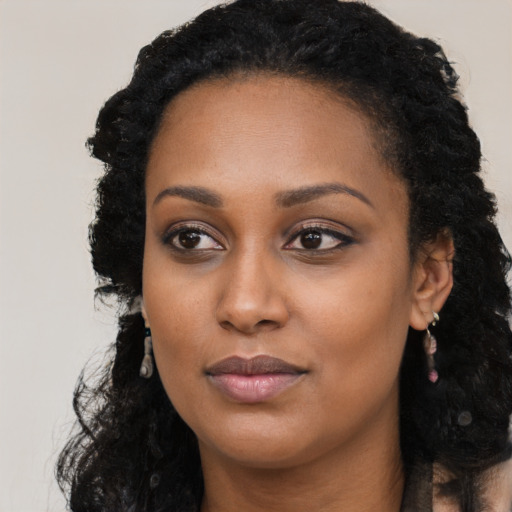 Neutral black young-adult female with long  black hair and brown eyes
