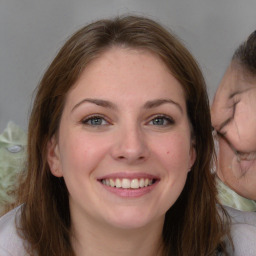 Joyful white young-adult female with medium  brown hair and blue eyes