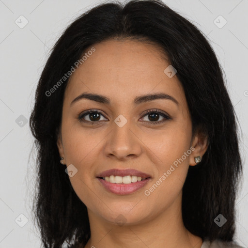 Joyful latino young-adult female with long  brown hair and brown eyes