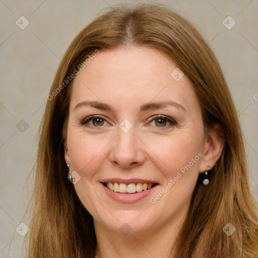 Joyful white adult female with long  brown hair and green eyes