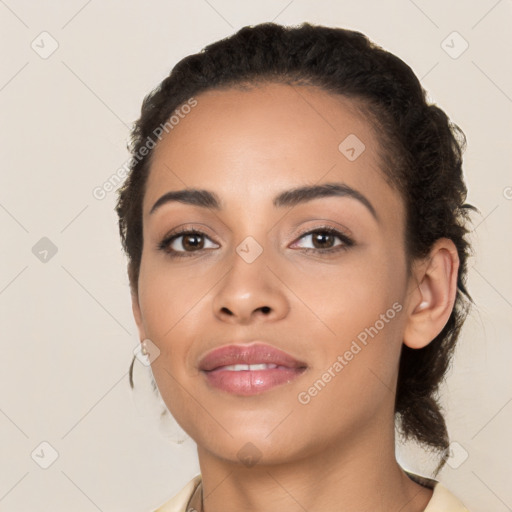 Joyful latino young-adult female with long  black hair and brown eyes