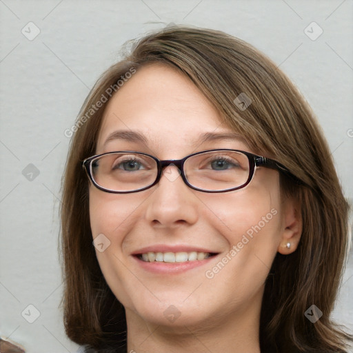 Joyful white young-adult female with long  brown hair and blue eyes