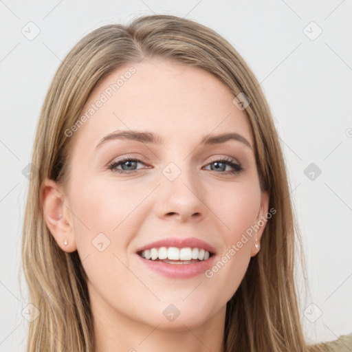 Joyful white young-adult female with long  brown hair and green eyes