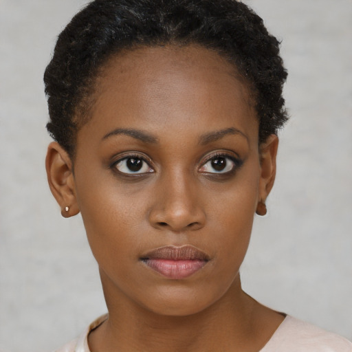 Neutral black young-adult female with short  brown hair and brown eyes