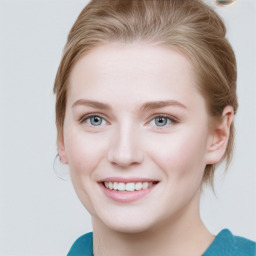 Joyful white young-adult female with medium  brown hair and blue eyes