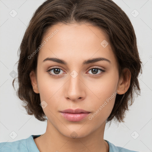 Neutral white young-adult female with medium  brown hair and brown eyes